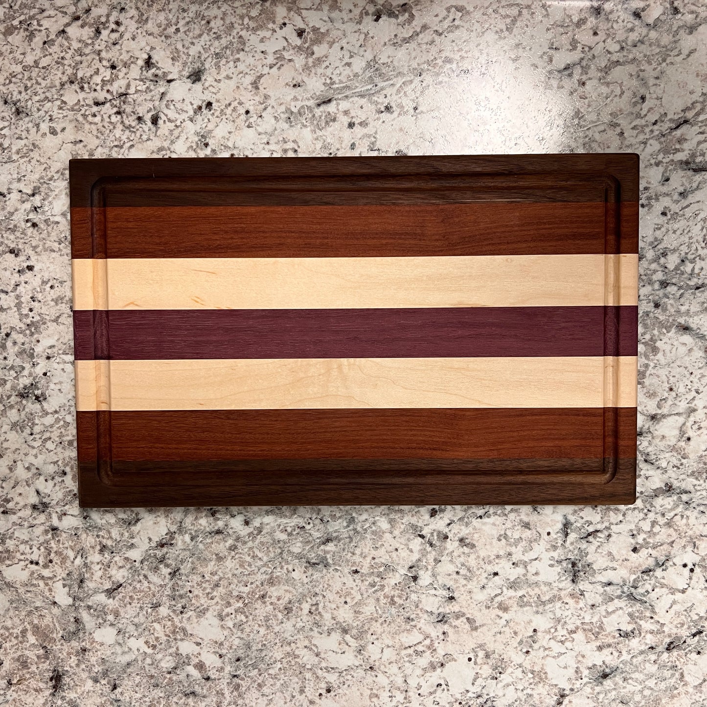 Walnut, Mahogany, Maple, and Purple Heart Cutting Board